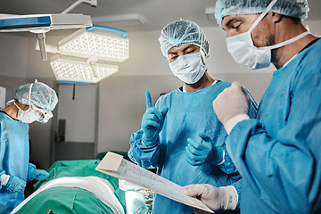 Image showing Surgery, documents or surgeons with teamwork for emergency, accident or healthcare in hospital. Paperwork, medical checklist or doctors in surgical collaboration in operating room to support or help
