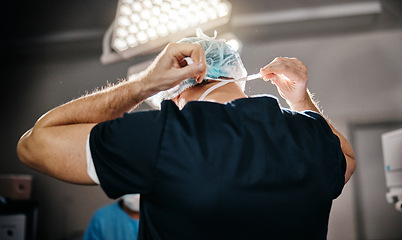 Image showing Healthcare, clothes and doctors in theatre for surgery, cardiovascular operation or service in hospital. Medical, surgeon and staff with uniform for safety, protection or procedure in operating room