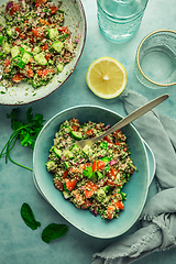 Image showing Tabbouleh salad. Fresh homemade Tabouli salad with fresh parsley, onions, tomatoes and hempseeds