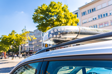 Image showing Detail of German police car with blue light  in a city