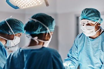 Image showing Doctor, surgery and operating room with face mask for medical emergency, operation or hospital. People, teamwork and healthcare for accident wellness for healing procedure, collaboration or helping
