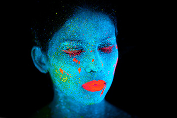 Image showing Face, uv and psychedelic paint for creative, art and glitter with unique surreal glow. Person, science fiction and color with dream, rave and abstract neon illusion for mystical fluorescent trance