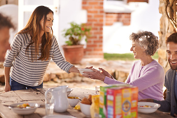 Image showing Family, eating and happy in garden for breakfast with serve, hosting and bonding for nutrition or wellness. Senior, women and relax together in backyard or patio in morning with healthy meal or food