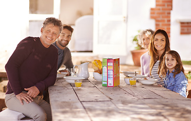 Image showing Happy family, portrait and breakfast in garden of home for nutrition, bonding or relax together with porridge. Parents, grandparents and child with healthy diet or meal at dining table in the morning