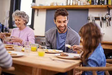 Image showing Love, breakfast and family in a kitchen with pancakes, eating or bonding at a table together. Food, diet and girl with father, grandmother and waffle for brunch, nutrition or communication at home