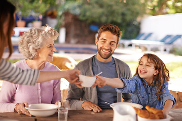 Image showing Happy family, food and breakfast in garden of home for nutrition, bonding and eating together with hosting. Parents, grandma and child with healthy diet, meal and relax at dining table in the morning