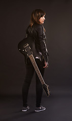 Image showing Woman, guitar and fashion for musical instrument, sound and trendy for retro and style on dark background. Young person, musician and artist for creative, funky and edgy for bold with leather jacket