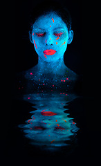 Image showing Face, neon and psychedelic reflection for creative, art and glitter with unique surreal glow. Person, science fiction and color for dream, rave or abstract uv illusion for mystical fluorescent trance