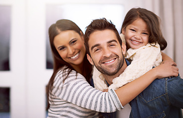 Image showing Mom, dad and kid in home for portrait with love or care, quality time and family bonding for memories or connection. Parents, girl and together for comfort or safety on weekend, hug and happiness.