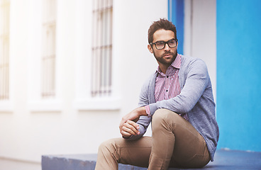 Image showing Man, fashion and confident in city with glasses, black frame for style with chic outfit and pride. Urban, unique and trendy designer clothes, spectacles for accessory and apparel with model outdoor