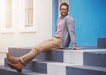 Image showing Man, fashion and happiness in city with glasses, relax with black frame for style and chic outfit. Urban, unique and trendy designer clothes, spectacles for accessory and apparel with model outdoor