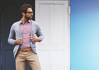 Image showing Man, fashion and posing in city with glasses, confident with black frame for style and chic outfit. Urban, unique and trendy designer clothes, spectacles for accessory and apparel with model outdoor