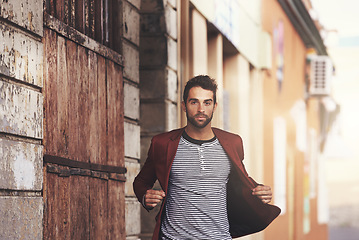 Image showing Man, portrait in city and fashion, confidence and serious outdoor with designer blazer for style and aesthetic. Urban, chic and edgy with pride, model in stylish jacket or clothing, apparel or outfit