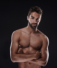 Image showing Portrait, muscle and body of confident man in studio isolated on a black background for wellness, sexy or six pack. Model, face and topless person with arms crossed for health and strong abs in Spain