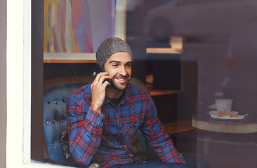 Image showing Phone call, smile and man by cafe window for communication, conversation or networking. Happy, technology and male person talking for mobile discussion with cellphone in coffee shop or restaurant.