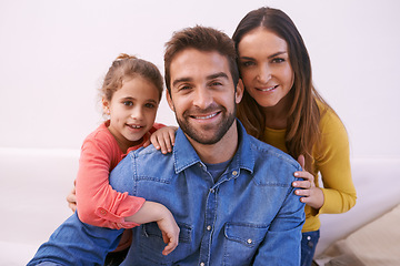 Image showing Family, portrait and home with girl, smile and bonding together with happiness and relaxing with weekend break. Parents, mother and father with daughter and fun childhood with cheerful kid and love