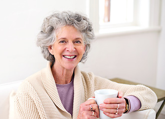Image showing Sofa, coffee and portrait of elderly woman in living room for morning, weekend and retirement. Relax, smile and senior person with happiness for warm beverage, drink and satisfaction at home