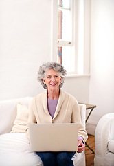 Image showing Laptop, sofa and portrait of elderly woman in living room for movie, weekend and enjoyment. Relax, smile and senior person with digital technology for happiness, streaming and retirement at home