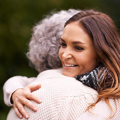 Image showing Hug, mother and woman with love, embrace and affection for bonding with happiness in nature. Family, elderly female person and daughter with mom for visit in garden, backyard and terrace in Italy