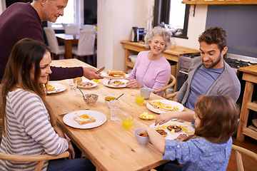 Image showing Love, breakfast and big family in a kitchen with pancakes, eating or bonding at a table together. Food, diet and kid with people in a house with waffle for brunch, nutrition or communication at home