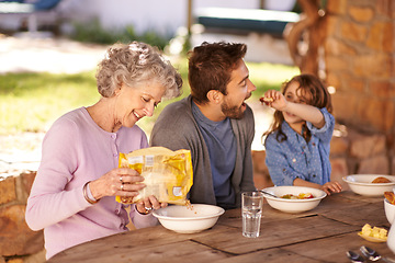 Image showing Happy family, food and breakfast in backyard of home for nutrition, bonding and eating together with porridge. Father, grandma and child with healthy diet, meal or feed at dining table in the morning