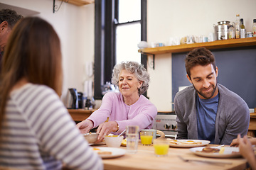 Image showing Breakfast, family home and grandparents with kitchen table, nutrition and smile with love and weekend break. Apartment, food and senior people eating meal together with conversation, joy and wellness