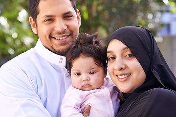 Image showing Muslim, family and portrait of parents with baby in park for bonding, Ramadan and outdoors together. Islam, happy and mother, father and newborn infant for love, childcare or support in garden