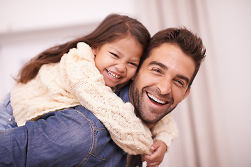 Image showing Happy, portrait and child piggyback on dad in home on holiday or relax with family on vacation. Hug, father and support girl on back with love for funny game, bonding and playing together on weekend