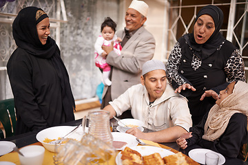 Image showing Muslim family, Eid and discussion by table with food for celebration, conversation and eating together. Islamic people, culture and religious holiday with lunch for nutrition, love and special event