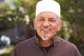 Image showing Happy, muslim and portrait of man outdoor with a smile in garden or relax on holiday in retirement. Arab, mature person and travel on vacation in summer to park or enjoy nature and trees in backyard