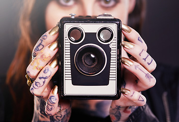 Image showing Tattoo, portrait or woman with retro camera in studio for hobby, creative photography or memory. Closeup, vintage technology or photographer with ink on hands or picture device on black background