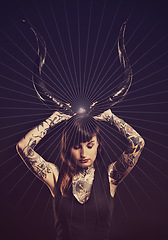 Image showing Horns, scary and woman with tattoo in studio for dark magic, horror or artistic aesthetic with mask. Creative nightmare, halloween culture or unique person with bone for demon on black background