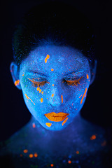 Image showing Face, neon and fluorescent paint for creative, art and glitter with unique surreal glow. Person, science fiction and color with dream, rave and abstract uv illusion for mystical psychedelic trance