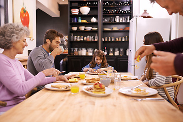 Image showing Breakfast, family home and grandparents with kitchen table and conversation with love and weekend break. Parents, food and senior people eating meal together with joy, social gathering and nutrition