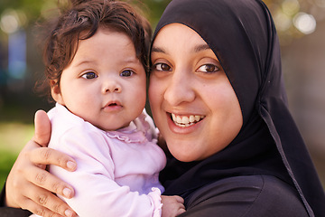 Image showing Muslim woman, mother and baby in portrait for love, care and bonding during Eid in Cape Town, South Africa. Female person, child and family together outdoor in nature, garden and backyard with smile