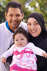 Image showing Portrait of mother, father and baby in park for bonding, relationship and outdoors together. Muslim family, nature and happy parents with newborn infant for love, childcare and support in garden