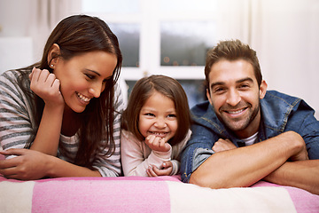 Image showing Portrait, family or smile in bed to relax, love or trust in diversity, bonding or together in house. Papa, mama or girl child as happy, multiracial or adoption as playful, positive or cozy in bedroom