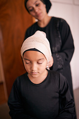 Image showing Mother, child and muslim with help, hijab and support for eid celebration and culture. Islamic family, kid and bonding together for love, growth and happiness with parenting and traditional headscarf