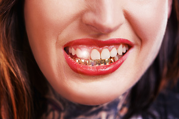 Image showing Woman, mouth and smile with gold teeth to shine for glamour and wealth with cosmetics. Closeup, dental jewelry and custom grill for fashion as female person with confidence, style and satisfied.