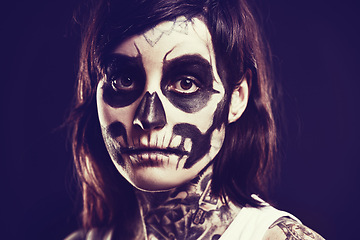 Image showing Skull, makeup and portrait of woman on black background for festival, Halloween and day of the dead. Creative art, skeleton and person with face paint for horror, scary and gothic aesthetic in studio