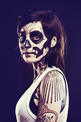 Image showing Skull, makeup and portrait of woman on dark background for festival, Halloween and day of the dead. Creative art, costume and person with face paint for horror, scary and gothic aesthetic in studio