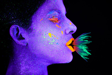 Image showing Neon, paint and woman with art in studio or plant for organic creativity, psychedelic aesthetic or cosmetics. Glow makeup, person or fluorescent glitter for uv illusion or fantasy on black background