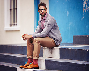 Image showing Man, building and relax on stairs for fashion, clothes and trendy with glasses outdoor in Cape Town, South Africa. Male person, gen z guy and vision for unique outfit, garment and urban style