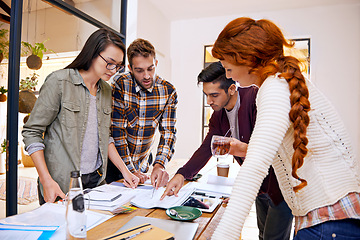 Image showing Paperwork, team or meeting in office, workspace or conference room for brainstorm in creative career. Job, planning or partnership with collaboration, working or documents for professional discussion