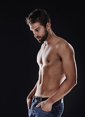 Image showing Thinking, muscle and body of man in studio isolated on black background for wellness, fitness or mockup space. Confidence, topless and abs of person for health, serious or strong bodybuilder in jeans