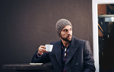 Image showing Thinking, cafe or man drinking coffee in city at table for breakfast with mockup space in the morning. Dream, tea cup or serious person with espresso, latte or plan future at shop with winter fashion