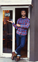 Image showing Open, cafe and portrait of man with sign at entrance of restaurant with small business owner. Smile, confidence and entrepreneur at coffee shop with career in service, hospitality and pride at door