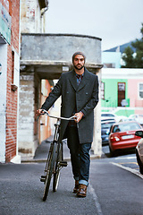 Image showing Bicycle, style and portrait of man in city for travel on winter vacation, adventure or holiday with retro fashion. Vintage, stylish and male person with bike, beanie and coat for outfit in town.