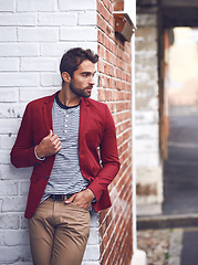 Image showing Fashion, thinking and man in city for travel on vacation, adventure or holiday with confidence. Pride, stylish and person with trendy, cool and casual outfit with ideas in urban town for weekend trip