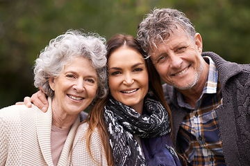 Image showing Portrait, outdoor and senior parents with adult daughter, embrace and happy with nature and bonding together. Face, family or group with fresh air and hug with smile and old mother with mature father